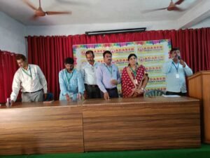 Student receiving BFSI Banking achievement certificate from Coursync during live training at Adarsh College Visakhapatnam.