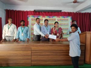 Student receiving BFSI live course certificate from Coursync during the ceremony at Adarsh College Visakhapatnam.