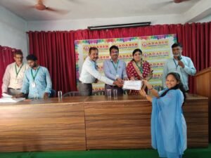 Student receiving banking course completion certificate from Coursync during BFSI training program at Adarsh College Visakhapatnam.