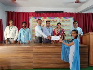 Student receiving banking training completion certificate from Coursync during BFSI course ceremony at Adarsh College Visakhapatnam.