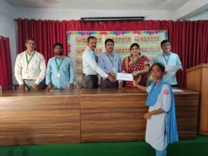 Student receiving BFSI Banking certificate during certificate distribution ceremony at Adarsh College Visakhapatnam.