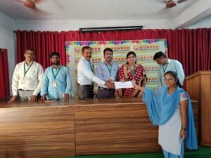 Student receiving BFSI Banking Training award certificate at Adarsh College Visakhapatnam after completing live banking course.