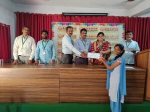 Student receiving BFSI course certificate from Coursync during live training at Adarsh College Visakhapatnam.