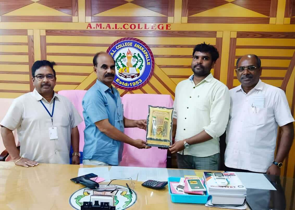 Instructor Anil receiving an award during the Coursync BFSI Banking program at AMAL College, Anakapalle.