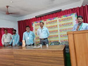 Guest speaker addressing students during the Coursync BFSI training event at Adarsh College Visakhapatnam.