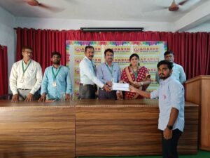 Student receiving live BFSI course certificate award from Coursync during ceremony at Adarsh College Visakhapatnam.