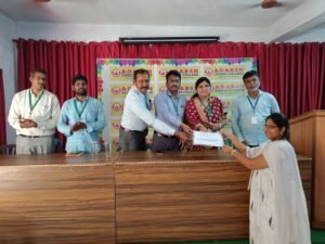 Student receiving BFSI course completion certificate from Coursync during live training at Adarsh College Visakhapatnam.